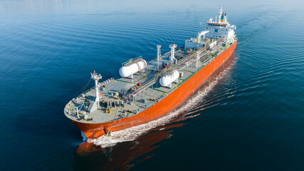 Aerial view of LPG gas ship. Gas carrier, gas tanker sailing in ocean - 558923639
