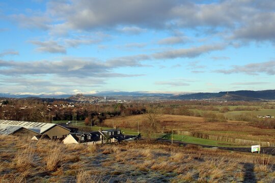 Stirling Castle, with Ben Vorlich and St&ugrave;c a' Chr&ograve;in behind, and the Wallace Monument, from Bannockburn, Stirlingshire.