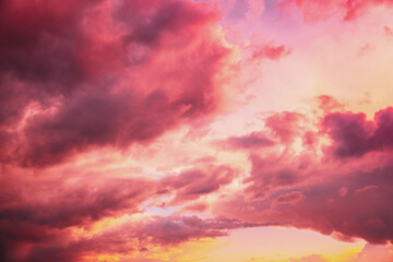 Sunrise bright dramatic sky. Scenic colorful sky at dawn. Sunset sky natural abstract background in pink purple red yellow colors.