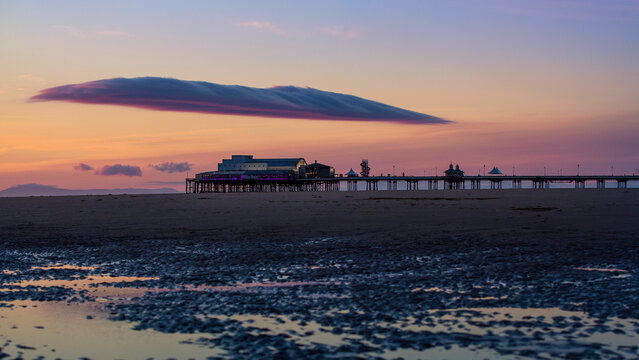 sunset at the beach with pier