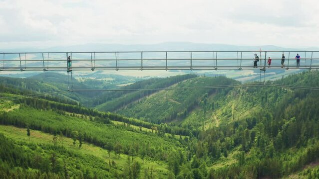 Flying along the longest Skybridge with walking people in the world, Dolni Morava, Czech Republic. 