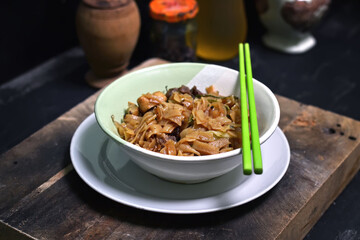 fried kwetiau beef, typical indonesian food in a bowl