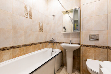 Photo of a bathroom in pastel colors with the lights on
