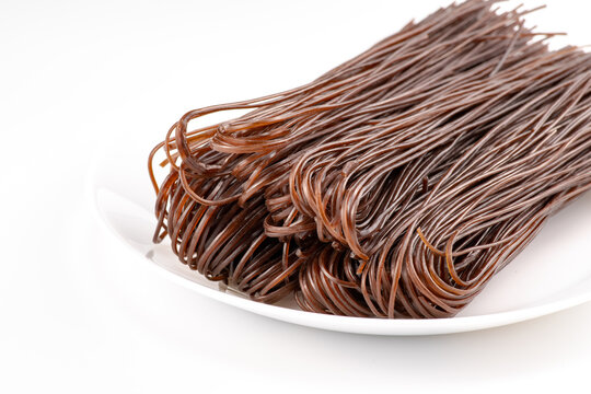 Fern root noodles (also called fern root vermicelli, Chinese name is 蕨根粉 Jue Gen Fen) are made of fern root powder.