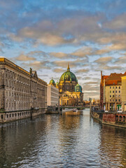 Berlin Cathedral, Spree canal and historic buildings during sunset, Germany