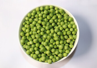A bowl of green beans in white background
