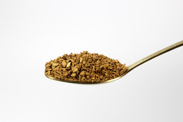 Instant granulated coffee in a spoon isolated on white background top grade