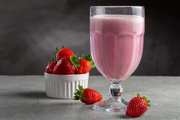 Glass with tasty strawberry smoothie.