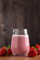 Glass with tasty strawberry smoothie.
