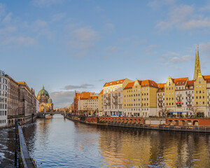 Historic buildings and Berlin Cathedral on Spree canal during sunset, Germany