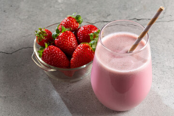 Glass with tasty strawberry smoothie.