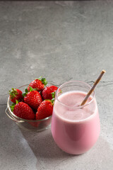 Glass with tasty strawberry smoothie.