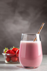 Glass with tasty strawberry smoothie.