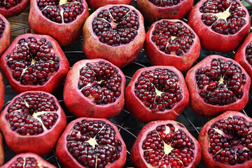 peeled fresh pomegranates for food background, top view