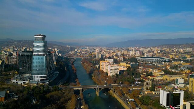 Bird view fly over the Kura river and beautiful city tbilisi