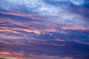 Obraz premium Coludy purple sunset sky photograph in winter season to be used as a background image and used to decorate graphics