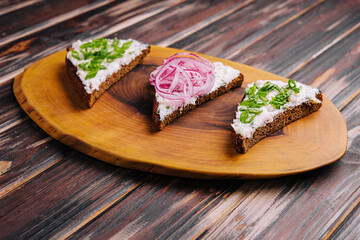 pieces of bread with delicious lard with red and green onions