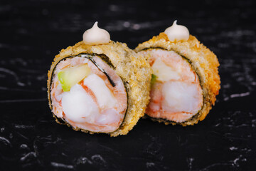 Warm rolls closeup on black stone