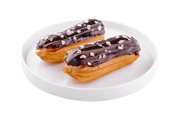Two eclairs with chocolate glaze in white plate