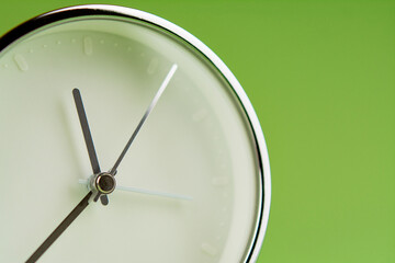 Alarm clock on green background, time concept, clock photo