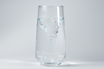 whirlpool in a glass of water on a White background.