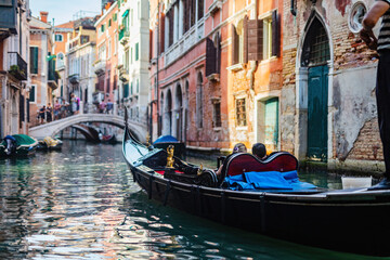 Gondola on canal in Venice, Italy.