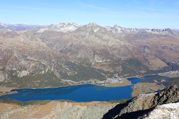 View from the Piz Corvatsch which is a mountain in the Bernina Range of the Alps, overlooking Lake...