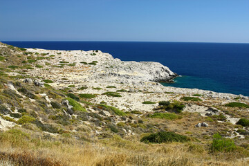 Fototapeta na wymiar Rock cliffs on the coast near the town of Kolymbia, Rhodes island, Greece. 