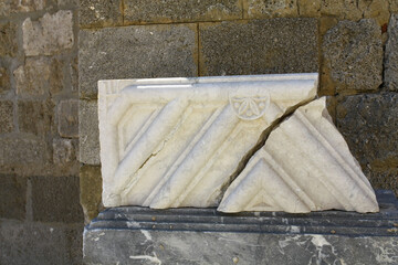 Broken decorative tile near the palace in the capital of Rhodes.