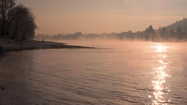 Steam rising from Rhine river near Unkel, Germany in winter due to extreme cold