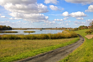 Road Panoramic landscape of autumn on the lake eastern Europe. Countryside landscape.