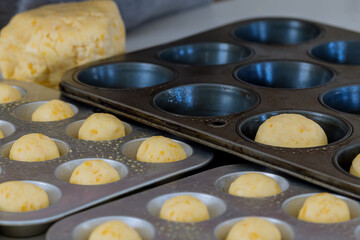 Preparation and baking of traditional cheese buns from Brazil as homemade snack