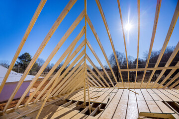 View residential building construction wood framing beams of under construction new house