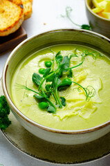 Pea Soup with Green Vegetables, Broccoli and Pea Sprounts with cheese on bright backround