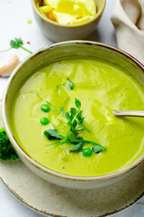 Pea Soup with Green Vegetables, Broccoli and Pea Sprounts with cheese on bright backround