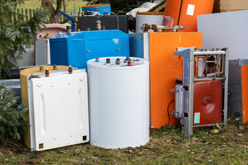 old dismantled heating and water heater at a junkyard