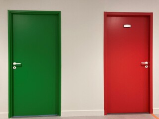 Italian flag formed by 2 doors: 1 green door, 1 red door and a white wall between the two.