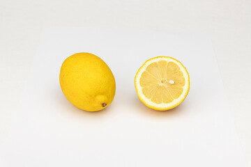 Yellow lemon fruit and lemon slice isolated on white background