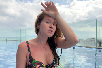 portrait of tired sick exhausted woman, beautiful girl is suffering from hot Summer heat stroke,...