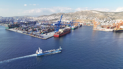 Fototapeta na wymiar Aerial drone panoramic photo of industrial container logistics unloading import and export container terminal of Perama - Piraeus, Greece