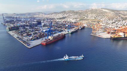 Fototapeta na wymiar Aerial drone panoramic photo of industrial container logistics unloading import and export container terminal of Perama - Piraeus, Greece