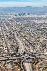 Aerial view of highway interchange Harbor and Century Freeway traffic portrait format with downtown...