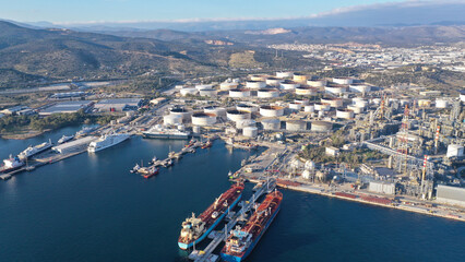 Fototapeta premium Aerial drone photo of Public Hellenic Petroleum and crude oil refinery in coastal industrial area of Elefsina, Attica, Greece