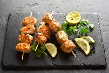 Salmon skewers on slate board