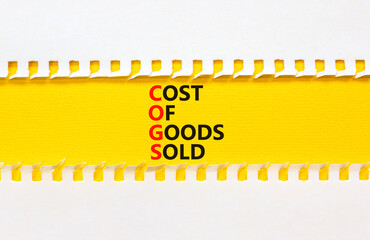 COGS cost of goods sold symbol. Concept words COGS cost of goods sold on yellow paper on beautiful white background. Business COGS cost of goods sold concept. Copy space.