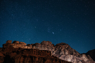 Nightsky over Wadi Rum mountains and desert landscape in Jordan