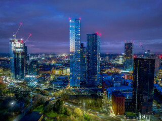 Deansgate Square Manchester England, construction building work at dawn with city lights and dark...
