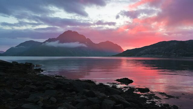 Pink summer sunset over the mountains in lofoten islands norway.
