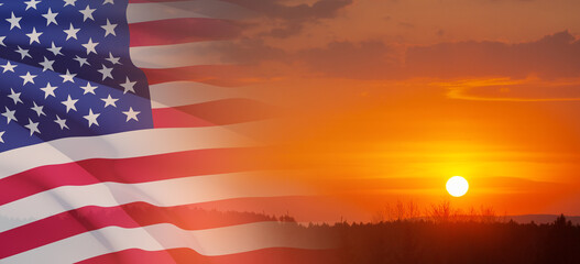 Fototapeta premium United States of America flag on sky at sunset or sunrise background. Independence day, Memorial day, Veterans day. Banner.