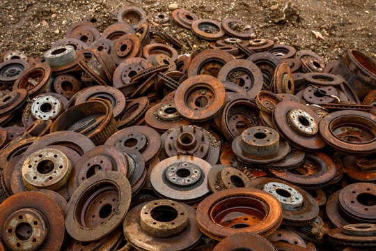 Pile Of Rusty Brake Rotors At Scrap Yard 